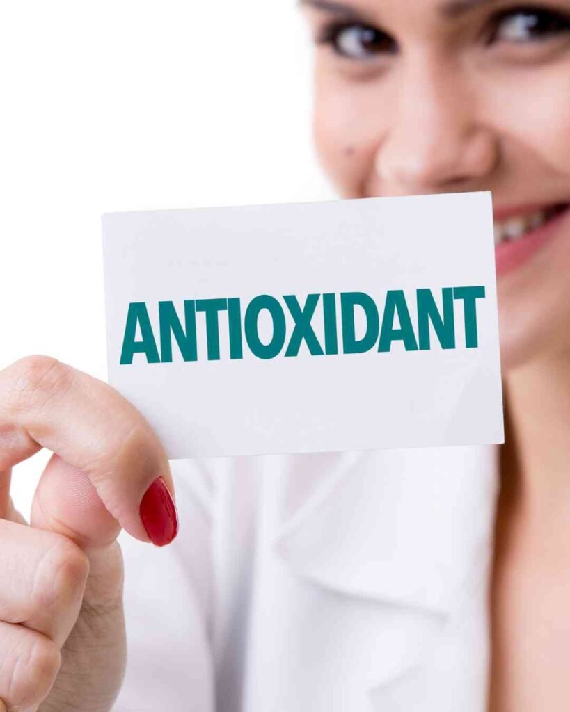 antioxidant card holding by a woman